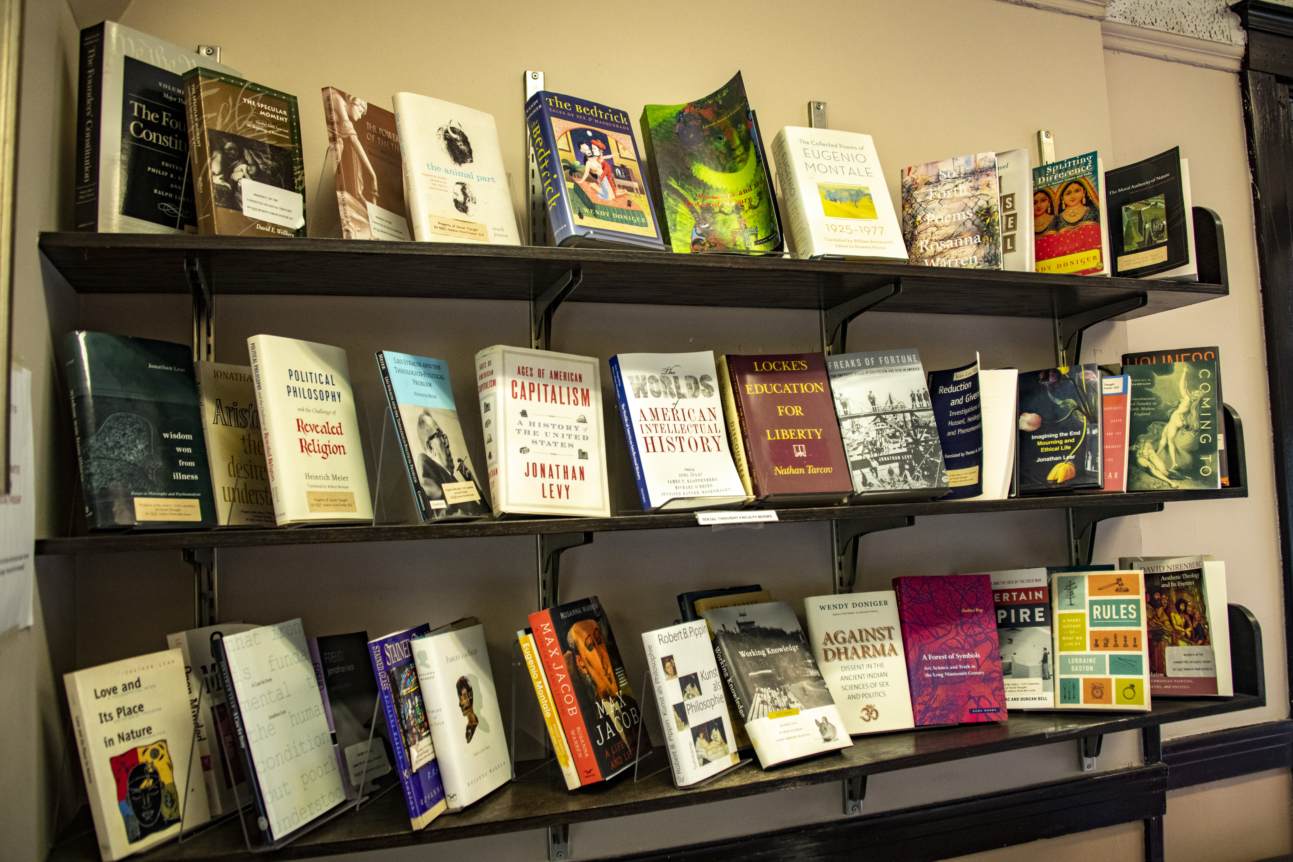 3 rows of books on a bookshelf