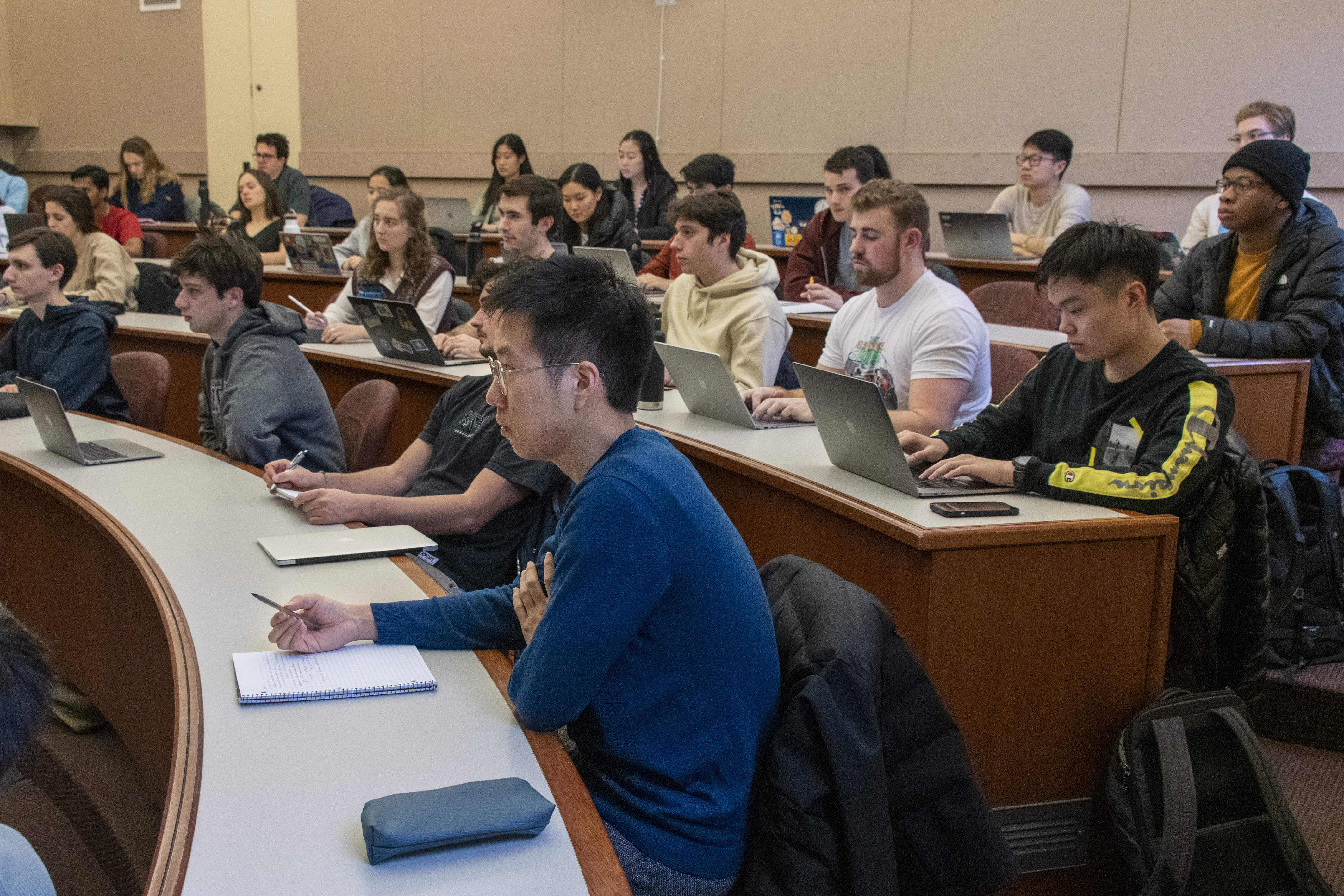 Students listening to a lecture in a lecture hall